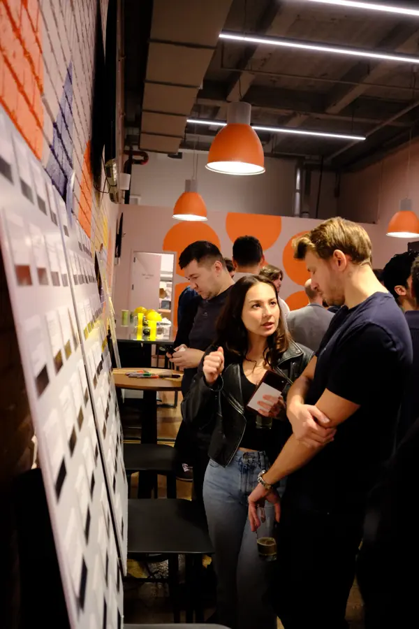 Attendees by the Growth Gems board