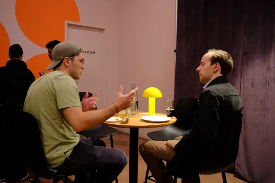 A conversation at a table in the lounge